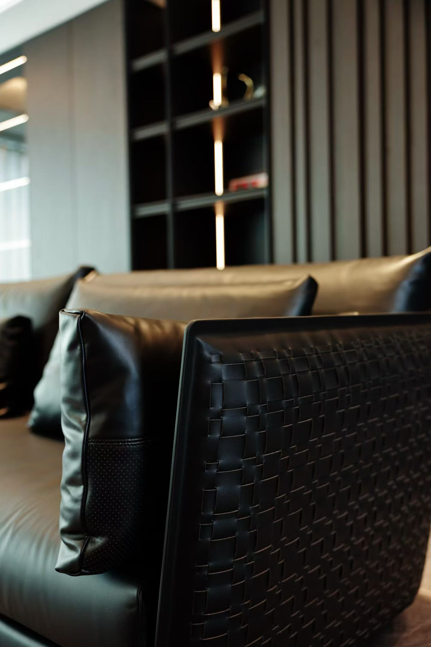 custom leather sofa and decorative lighting detail in apartment living room