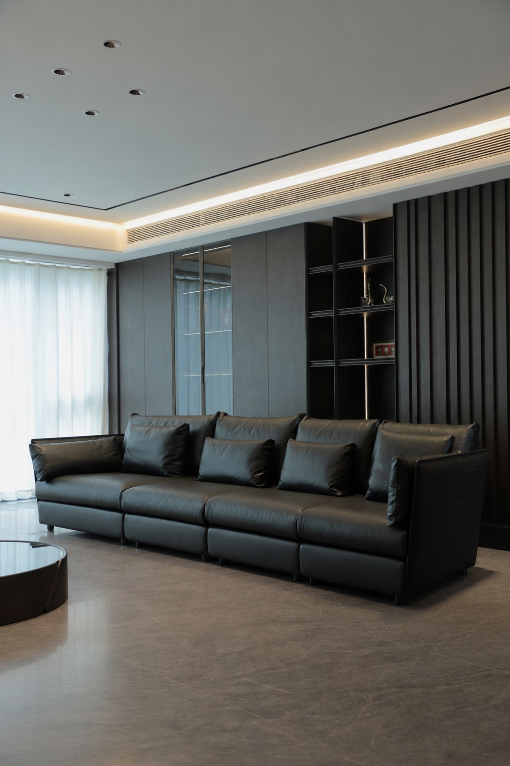 custom leather sofa, shelving and wall finishes in high-end apartment living room