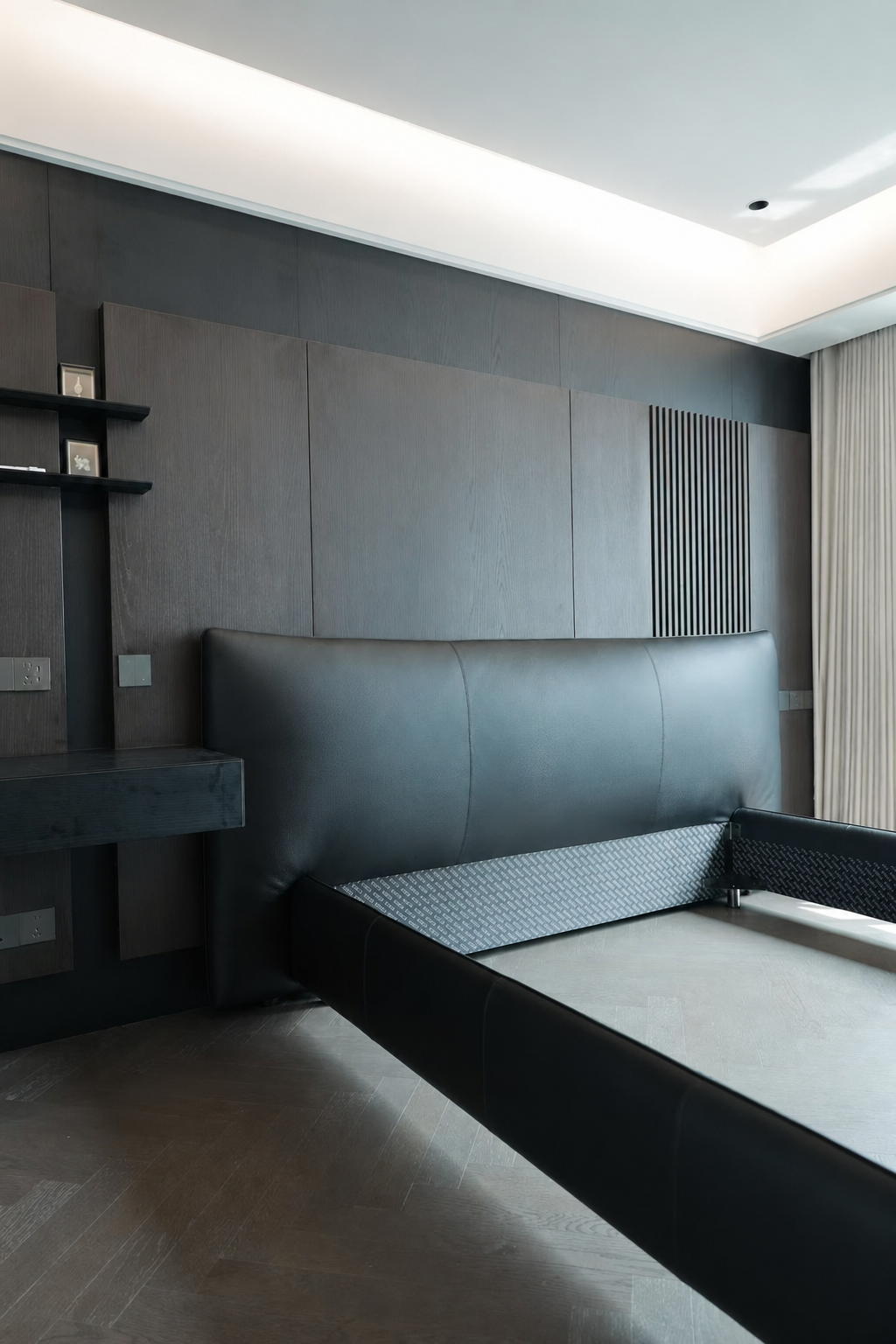 custom master bedroom furniture with dark wall panels and upholstered bed