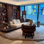 Luxury villa living room with custom sofa, lounge chair and wood storage