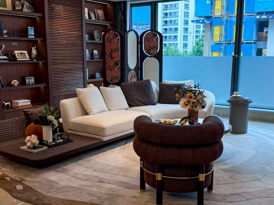 Luxury villa living room with custom sofa, lounge chair and wood storage