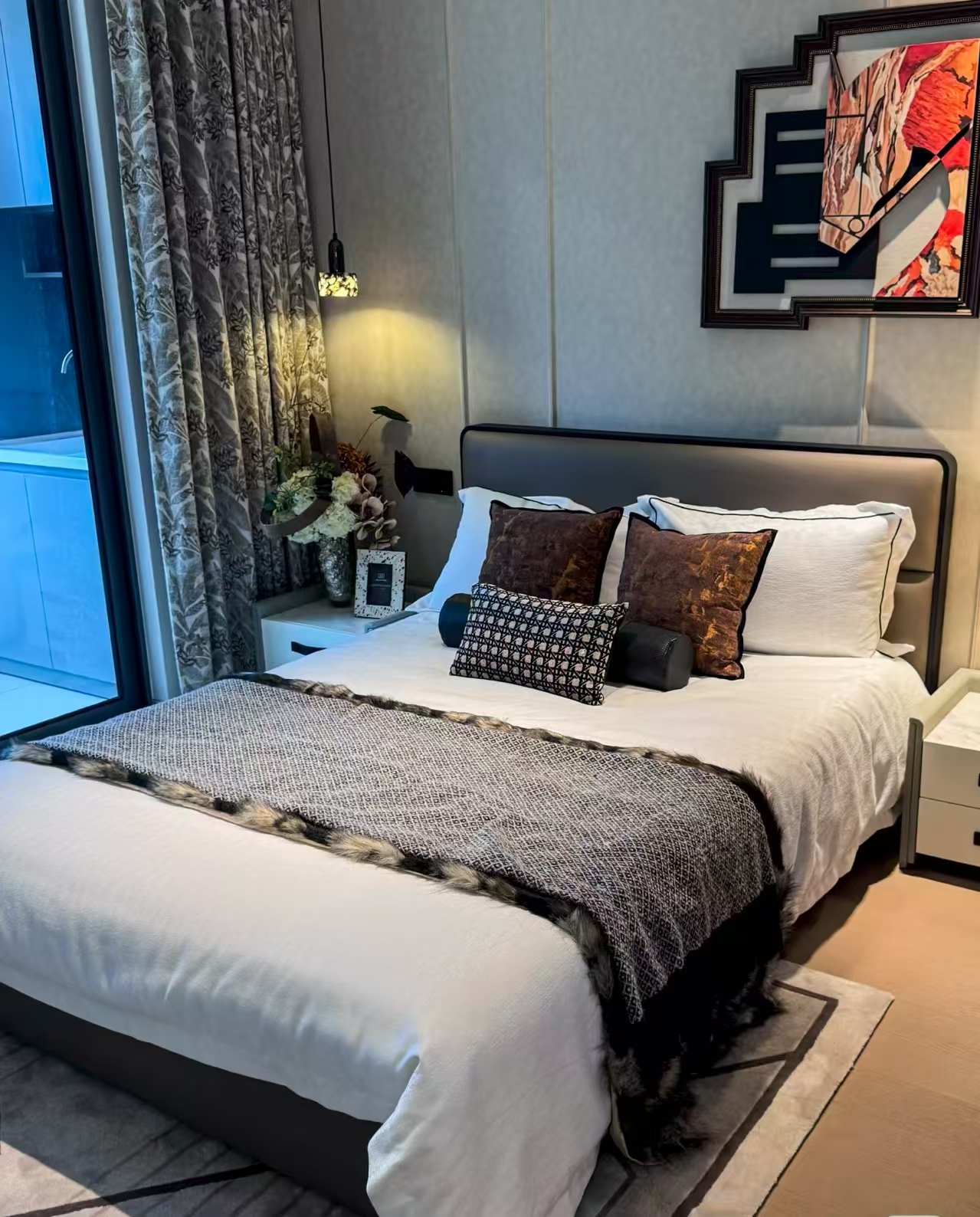 custom villa bedroom with bedside lighting and wall art