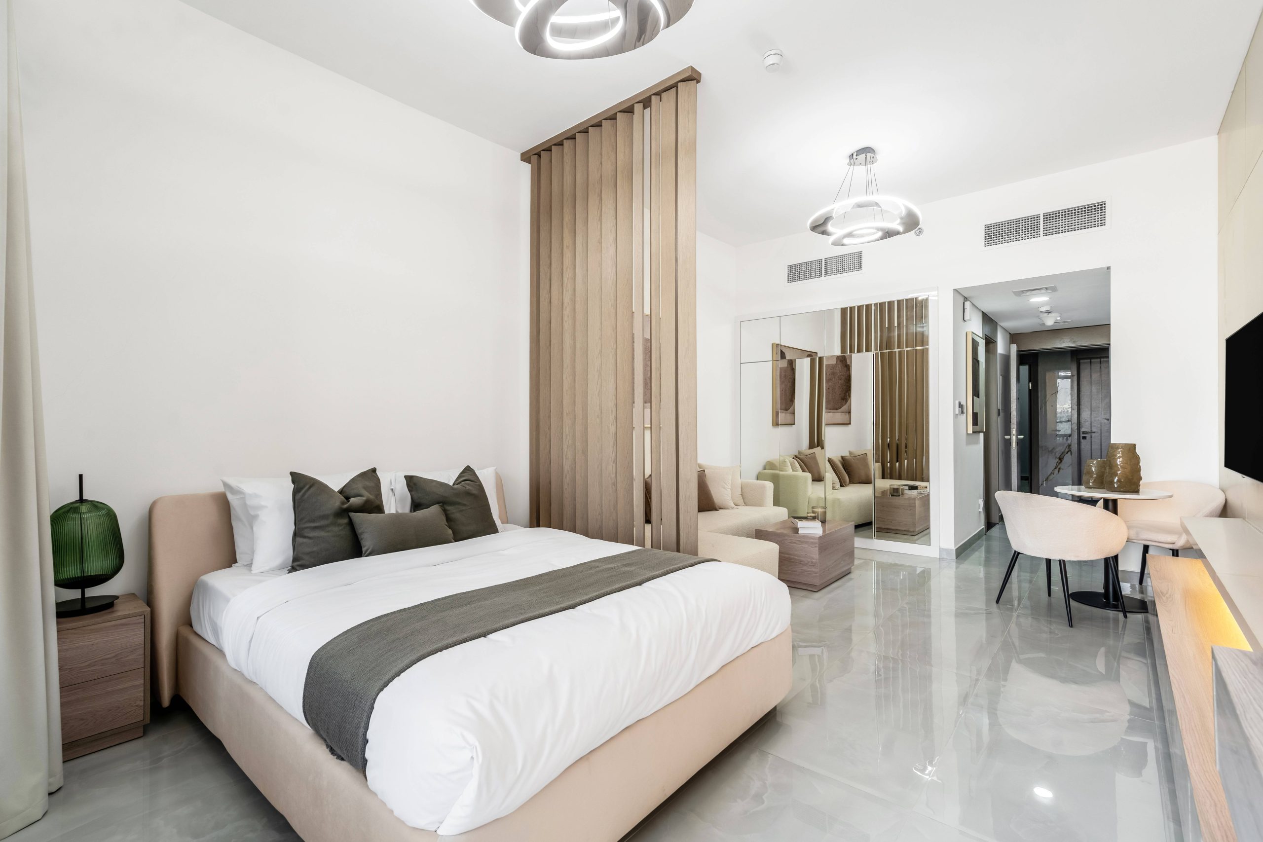 Custom upholstered bed and integrated apartment furniture at OST Tower 11 in Dubai Majan