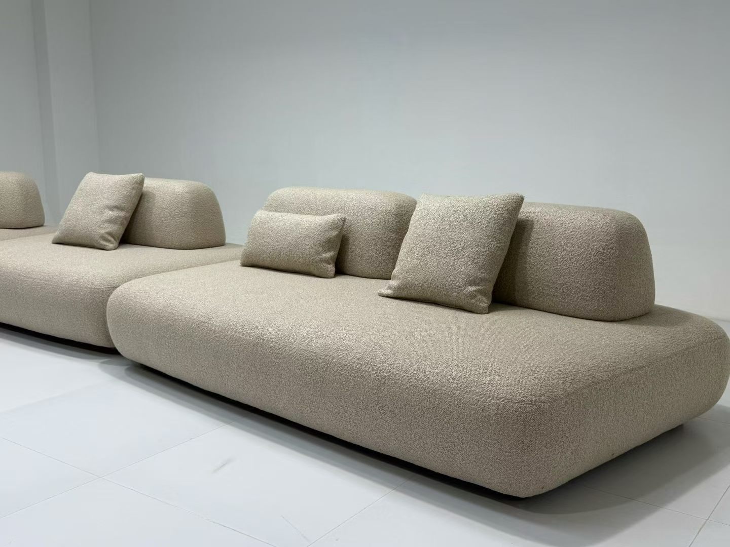 Custom modular boucle sofa with rounded low-profile design