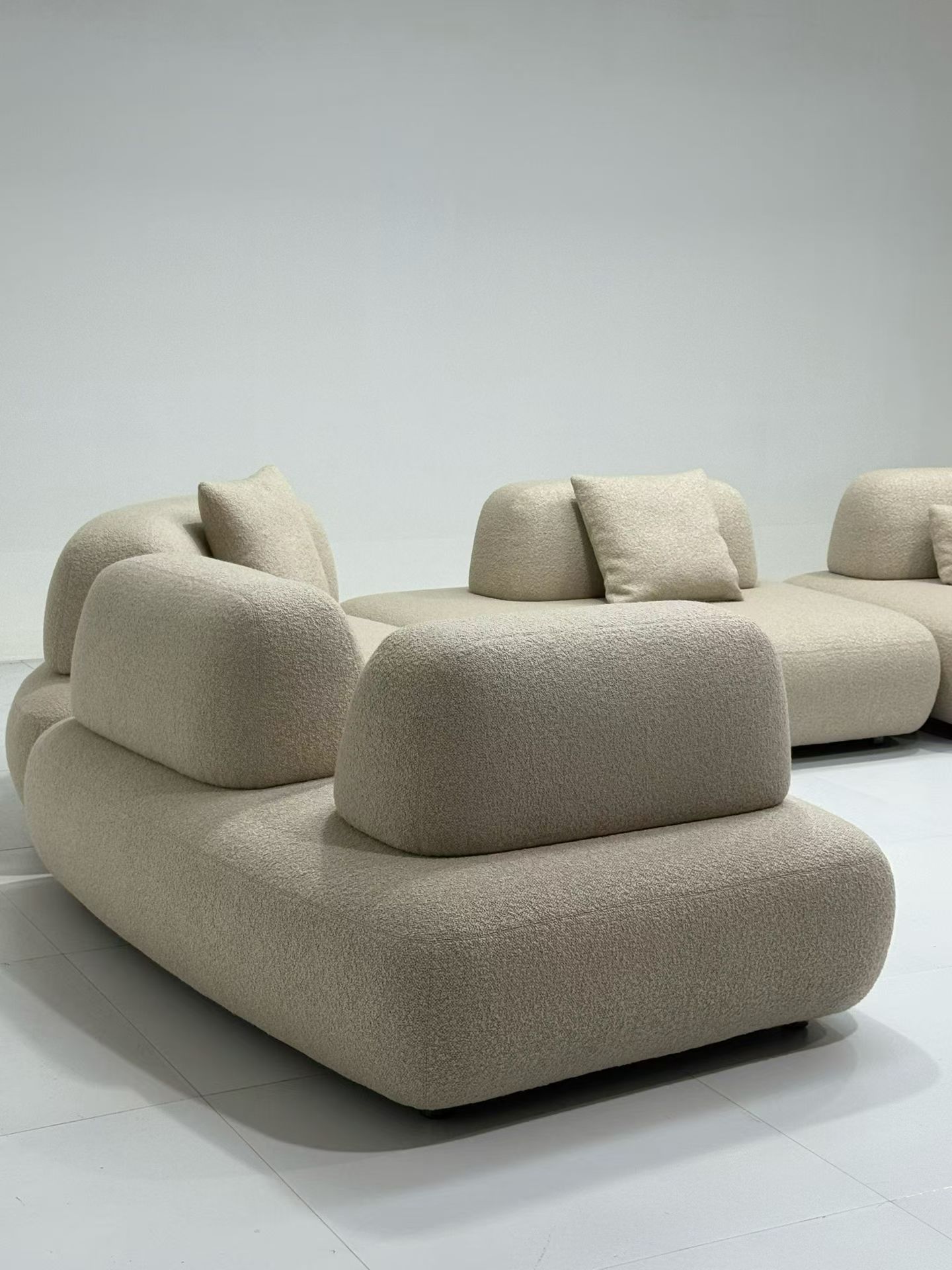 Custom boucle armchair and modular sofa collection for high-end interiors